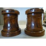 A pair of late 19thC turned walnut capstan design tobacco boxes with covers 6.