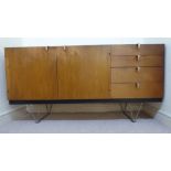 An early 1960s John & Sylvia Reid design Stag S Range teak sideboard, the pair of door,