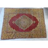 A Turkish runner with a central medallion and flora spandrels on a red ground 49'' x 67''