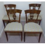 A set of four early 19thC Biedermeier satinwood framed side chairs with carved backs and