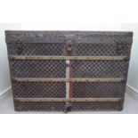 A late 19th/early 20thC Louis Vuitton checkered fabric clad trunk with studded beech batons,