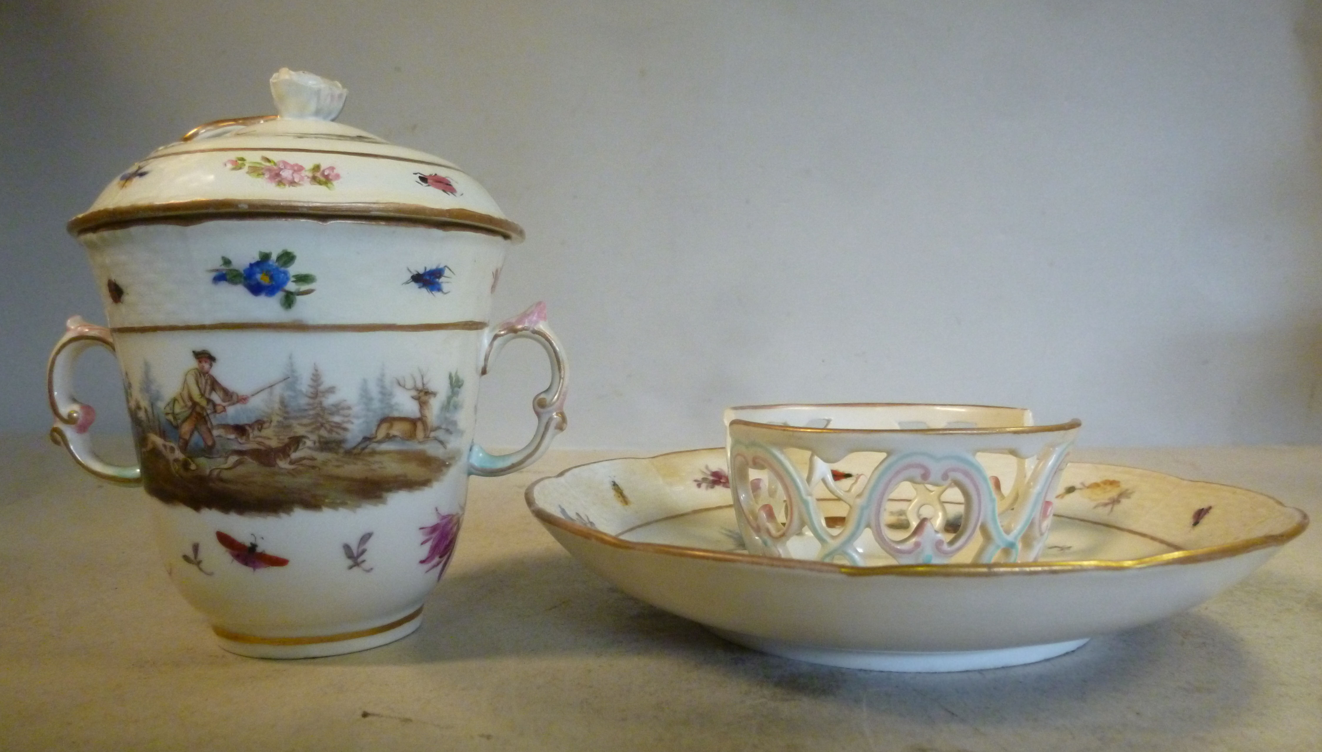 A late 18thC Berlin porcelain covered, twin handled chocolate cup and cover,