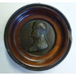 An early/mid 19thC cast and patinated bronze plaque, featuring the head and shoulders,