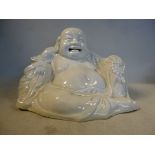 An 18th/19thC Chinese blanc de chine figure, a seated Buddha,