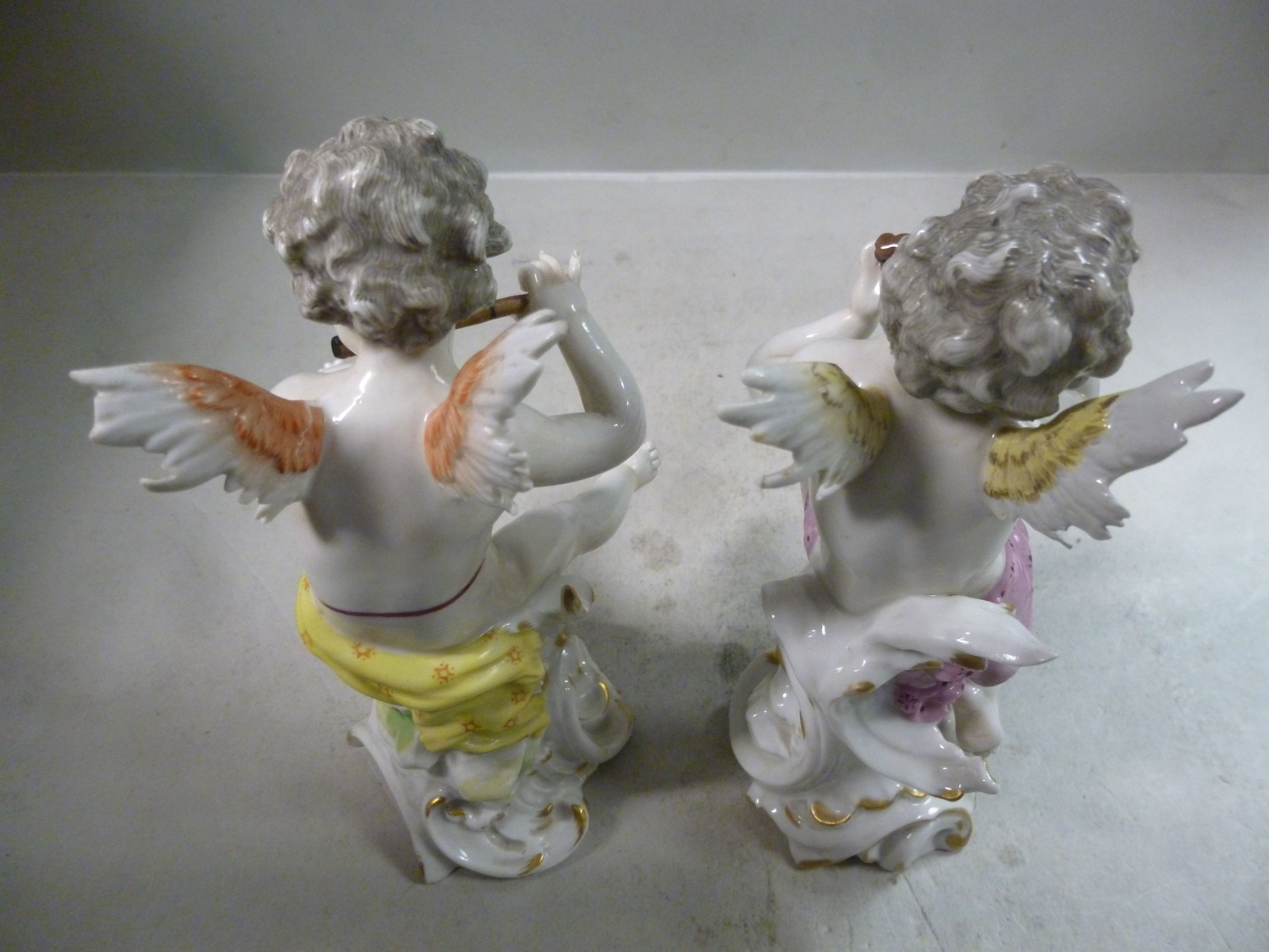 A pair of early 20thC Frankental porcelain seated cherubic figures, one playing panpipes, - Image 5 of 7