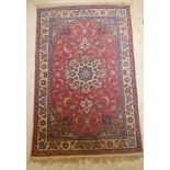 An Isfahan rug with a central medallion, entwined vines,