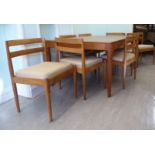 A Magnus Olesen teak dining table, the top with a mitred border, raised on turned,