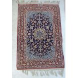 A Central Persian rug with a medallion, vines,