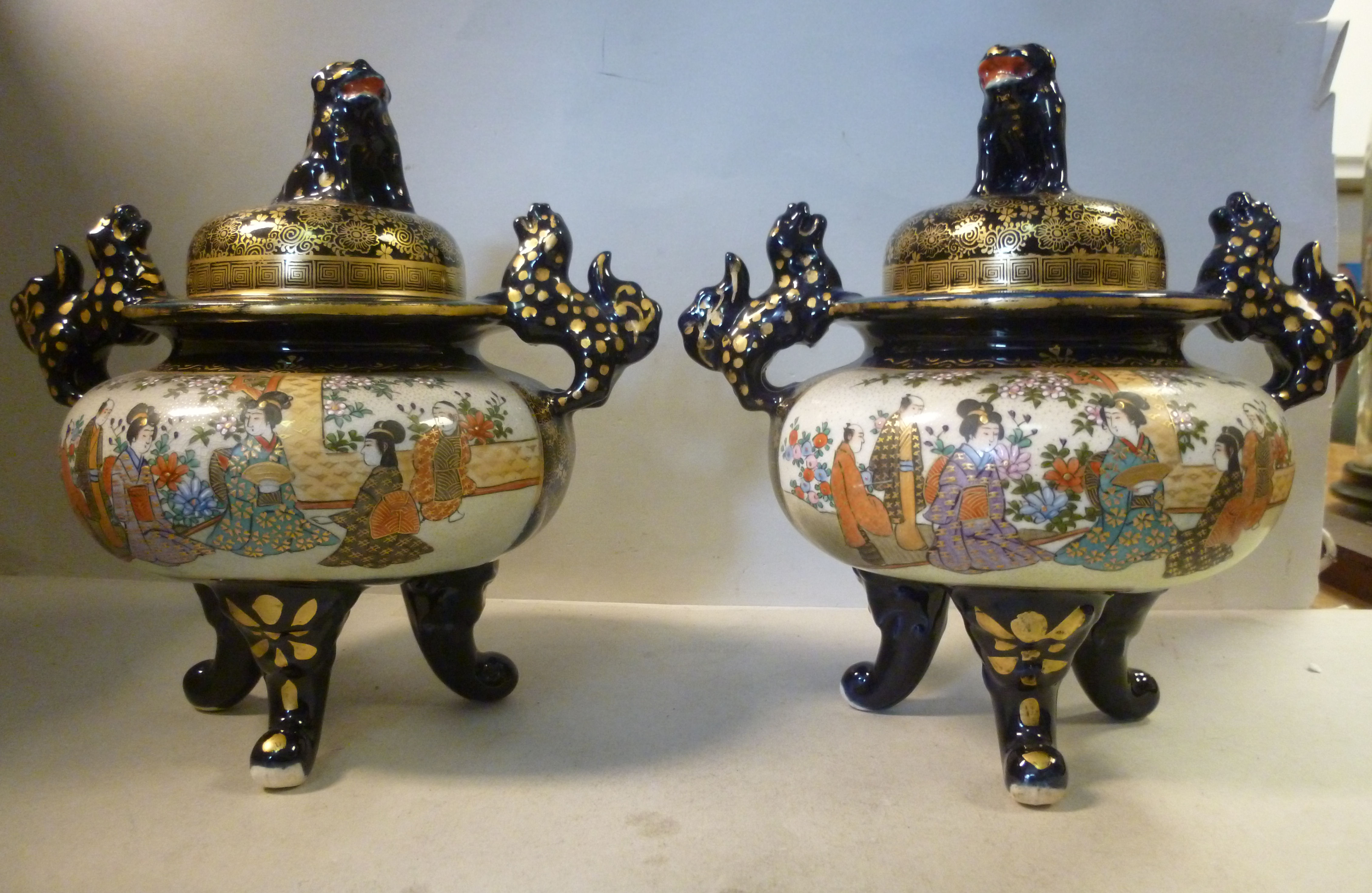 A pair of 20thC Japanese Satsuma earthenware censer design vases with domed covers,