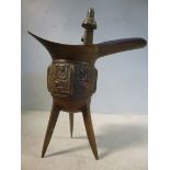 An early 20thC cast bronze, single handled pouring vessel, cast with archaic motifs,