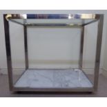 A 1960s rectangular sectional chromium plated steel framed tea trolley with an inset glass top,