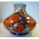 A Moorcroft pottery vase of squat, bulbous form with a narrow, flared neck,