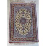 A Central Persian rug with a central star medallion, entwined vines, boteh,