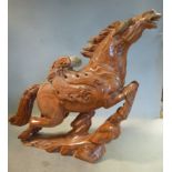 A 20thC Chinese striated coral coloured jadeite model, a leaping,