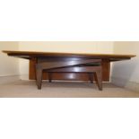 A 1960s teak and stained beech coffee table, converted to a dining table,