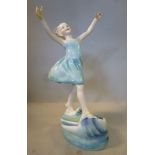 A Royal Worcester china figure wearing an aqua coloured dress 'Dancing Waves' No.