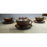 A set of four Chinese/South East Asian inlaid Paktong cups with white metal interiors and matching