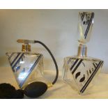 An Art Deco clear glass dressing table bottle and stopper of three dimensional triangular design,