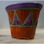 A Clarice Cliff Original Bizarre china miniature flower pot, decorated in green,