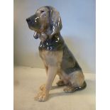 A Royal Copenhagen porcelain model 'Seated Bloodhound' No.