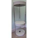 A 1960s white enamelled three tier, floorstanding shelf unit with chromium plated,