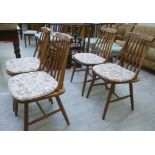A set of four modern stained beech bar and spindle back dining chairs,