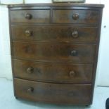 A mid Victorian mahogany bow front dressing chest with two short/four long graduated drawers,