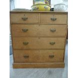 An early 20thC light oak dressing chest with two short/three long drawers,