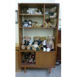 A 1970s Schreiber teak finished living room unit, comprising an arrangement of open shelves,