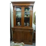 A late Victorian mahogany cabinet bookcase with two glazed doors and two panelled doors,