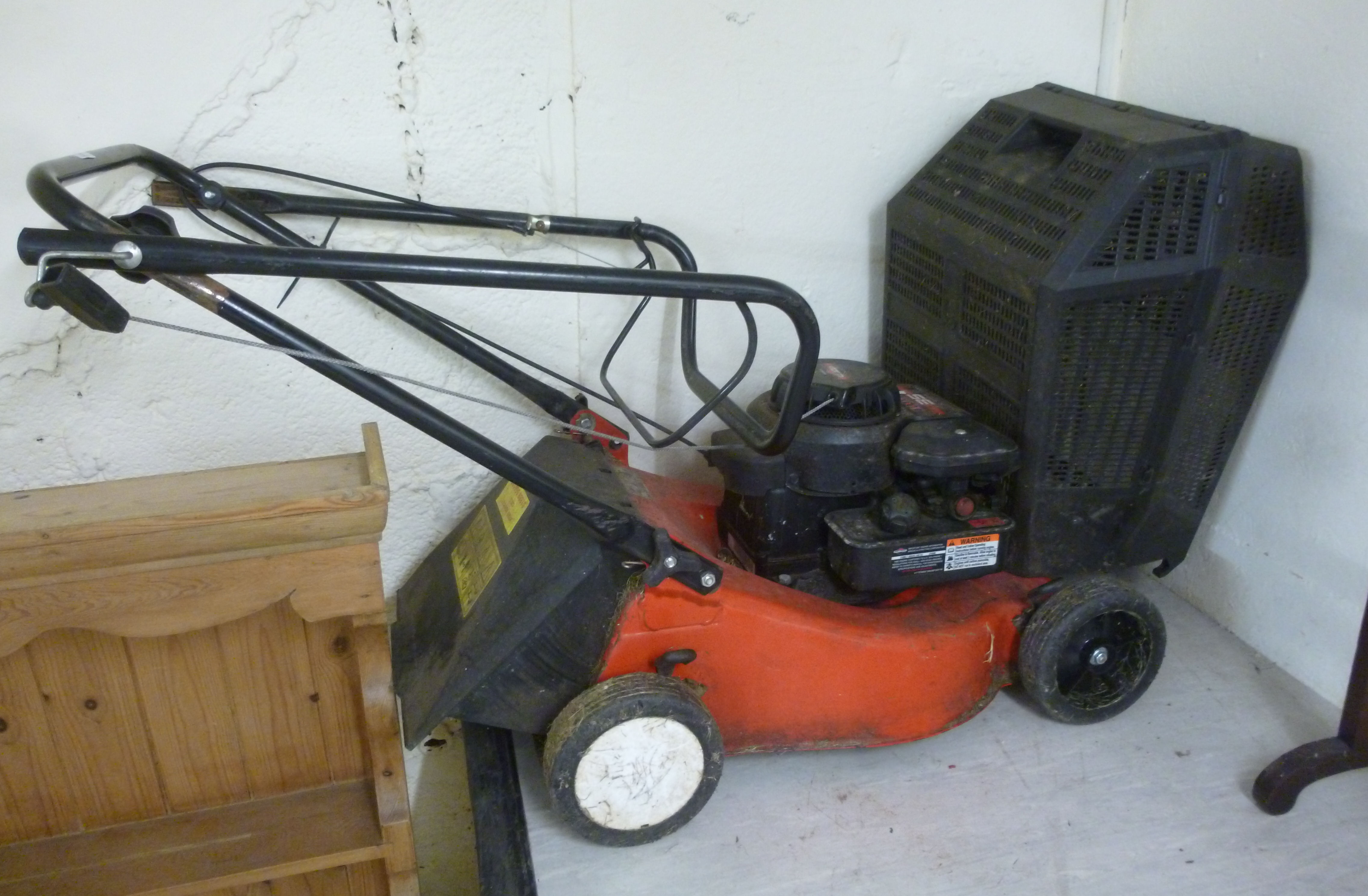 A Briggs & Stratton Champion 35 petrol driven rotary lawnmower with a 14''cut BSR