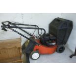 A Briggs & Stratton Champion 35 petrol driven rotary lawnmower with a 14''cut BSR