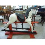 A 1920/30s carved and painted wooden nursery rocking horse,
