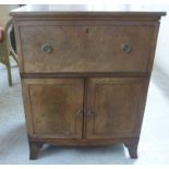 A late 19thC mahogany bedside chest with a single drawer, over a pair of doors,