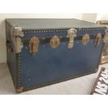 An early 20thC canvas bound cabin trunk with applied steel mounts 21''h 36''w BSR