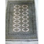 A Turkoman rug with two columns of seven octagonal guls on a brown ground 50'' x 72'' CB