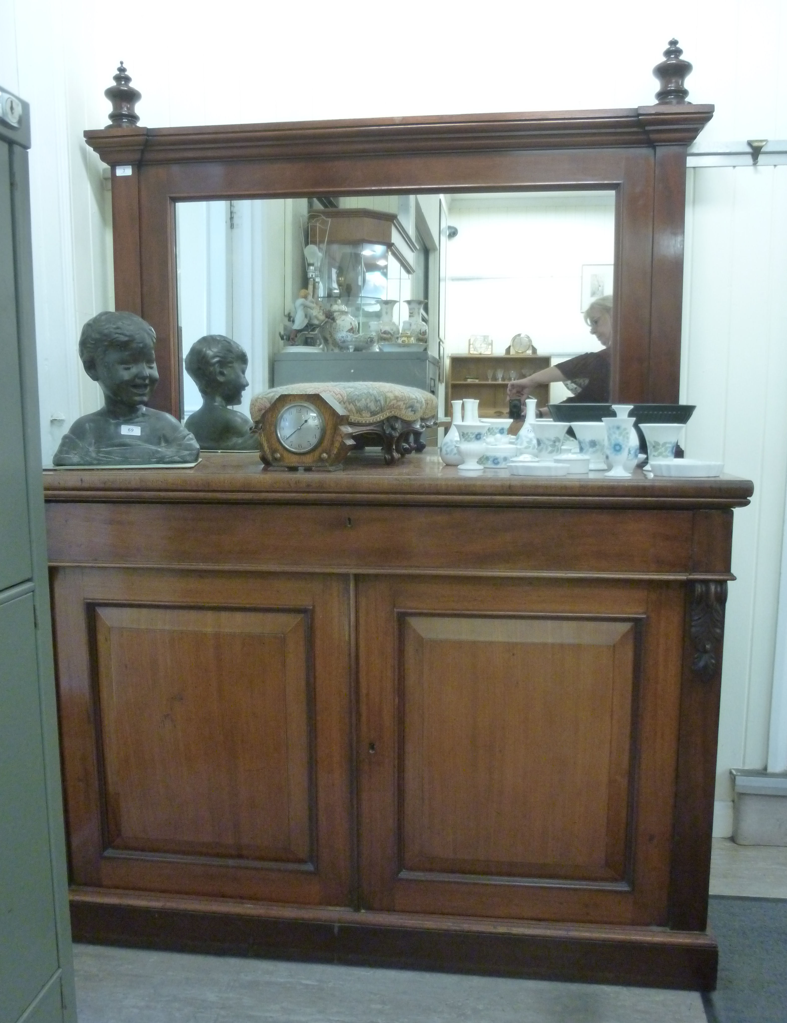 A late Victorian mahogany sideboard, having a mirrored back,