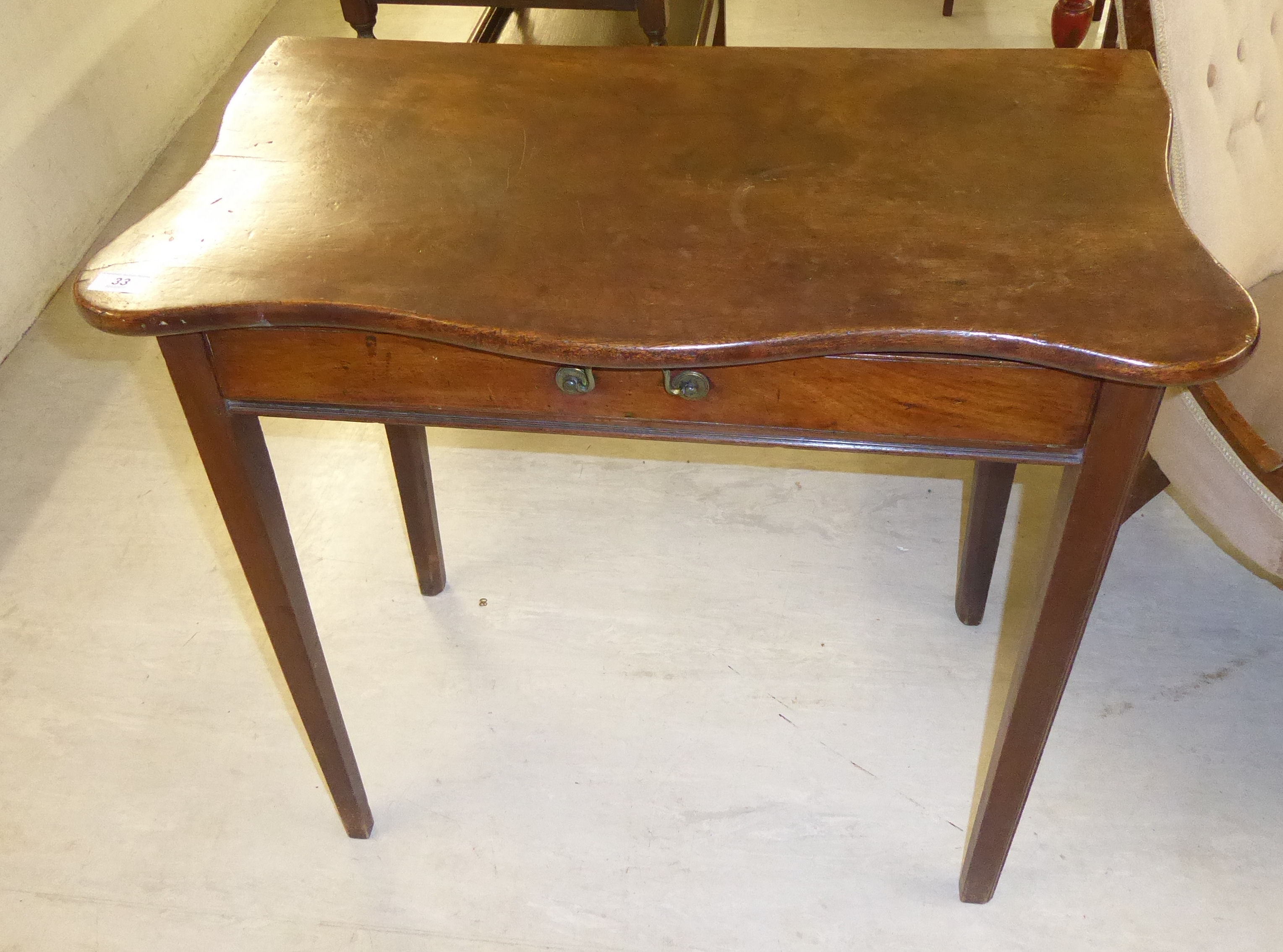 A late Victorian mahogany serpentine front hall table with a single drawer, raised on square, - Image 2 of 2