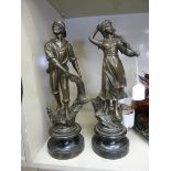 A pair of late 19thC bronzed spelter figures, a fisherman and his wife,