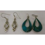 Two pairs of silver pendant earrings,