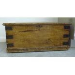 An early 20thC painted and grained pine box with iron re-enforcement,