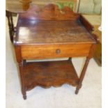 An early 20thC mahogany finished washstand with a swan neck pediment upstand and a single drawer,