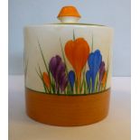 A Clarice Cliff Bizarre china Crocus pattern drum design conserve pot and cover with a finial