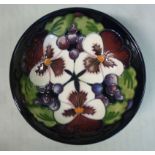 A modern Moorcroft pottery footed shallow dish, decorated in tubeline with stylised thistles,