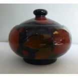 A Moorcroft pottery bulbous pot and cover with a knop finial,