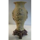 A 20thC Chinese carved bi-coloured soapstone vase, decorated with a songbird and flora,