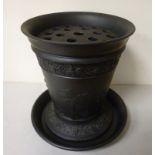 A Wedgwood black basalt vase of tapered cylindrical form, on a splayed footrim,