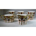 A set of three Royal Crown Derby bone china Old Imari pattern (1128) beaker cups;