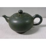 A mid 20thC Chinese green pottery teapot of small proportions,