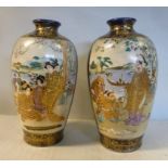 A pair of early 20thC Satsuma earthenware baluster shaped vases with narrow necks and rolled rims,